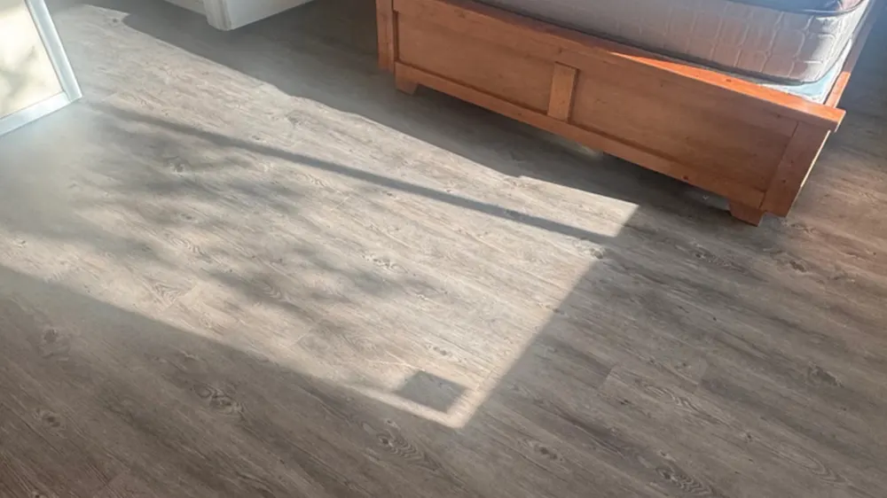 Luxury vinyl plank flooring in a bedroom